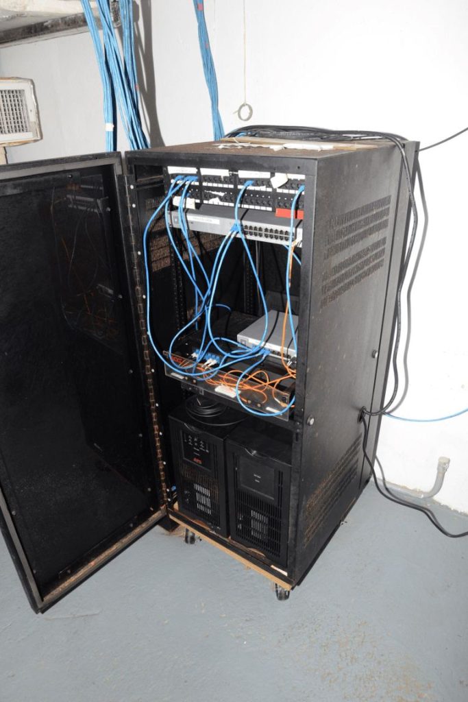 rows of network cables in a mining server room
